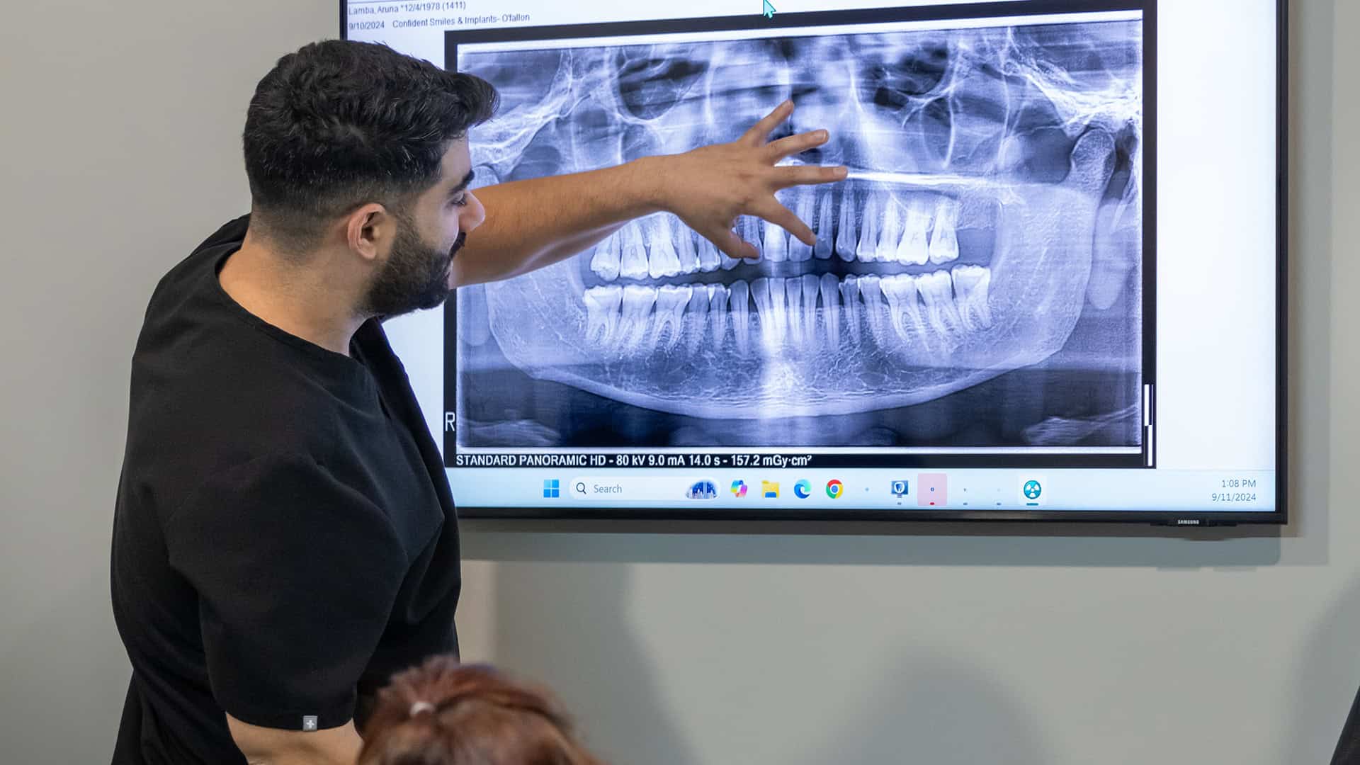Dr. Sultan Viewing Dental Implant X-Ray