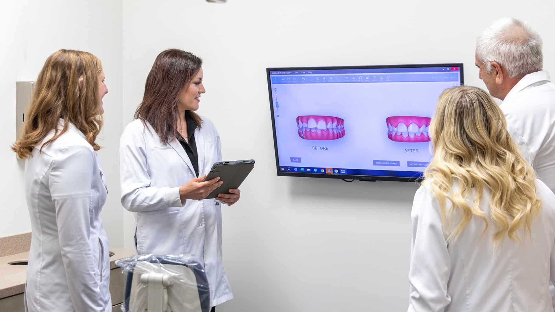 Dentists Reviewing Dentures X-Ray