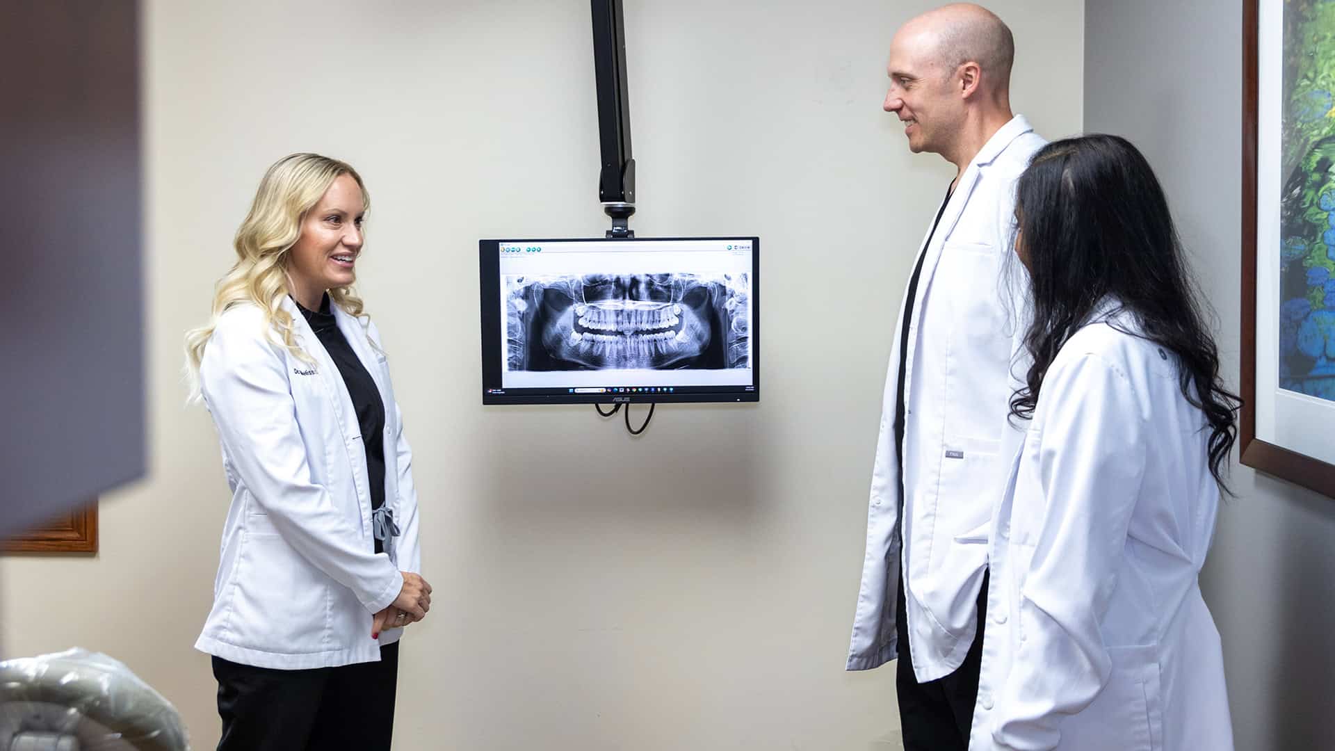 Dentists Reviewing Fillings X-Ray