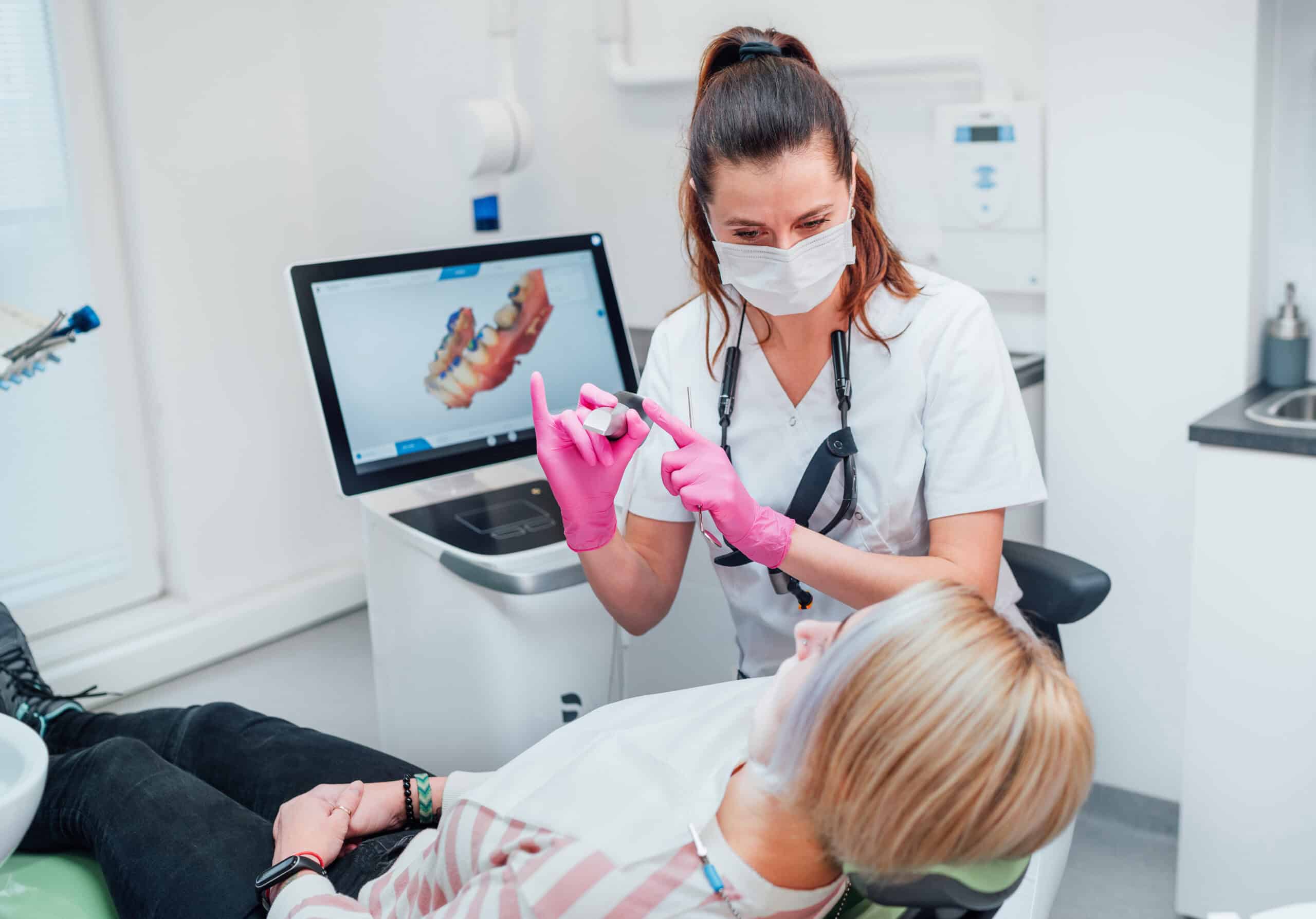 Dentist Using Intra Oral Scanner on Patient