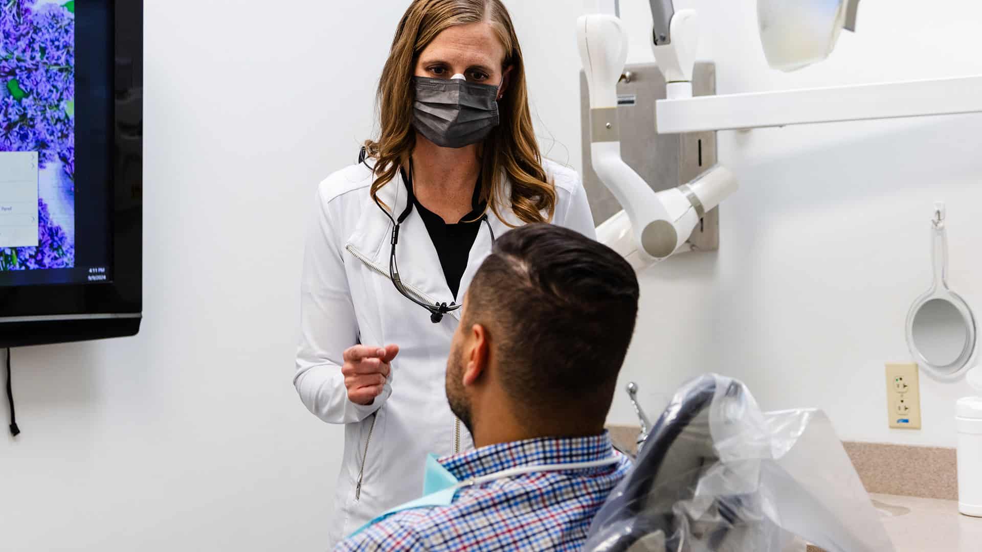 Dentist Talking With Patient About Tooth Pain Management